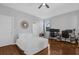 Cozy bedroom with a comfortable bed, wood flooring, and a dedicated workspace at 9816 Palmetto Dunes Ct, Orlando, FL 32832