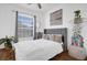 Stylized bedroom featuring a cozy bed, large window, and unique decorative elements at 9816 Palmetto Dunes Ct, Orlando, FL 32832