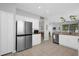 Bright kitchen featuring stainless steel appliances, granite countertops and tile flooring at 9816 Palmetto Dunes Ct, Orlando, FL 32832