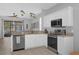 Well-equipped kitchen boasting stainless steel appliances, granite countertops, and ample cabinet space at 9816 Palmetto Dunes Ct, Orlando, FL 32832