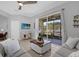Living room with sliding glass doors leading to the outside patio at 9816 Palmetto Dunes Ct, Orlando, FL 32832