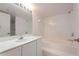 Bathroom featuring a single sink vanity and separate shower and soaking tub at 1 John Anderson Dr # 317, Ormond Beach, FL 32176