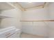 Walk-in closet space featuring carpet and built in shelving and drawers at 1 John Anderson Dr # 317, Ormond Beach, FL 32176