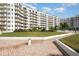 Stunning condominium exterior boasting multiple stories and balconies overlooking beautifully landscaped grounds at 1 John Anderson Dr # 317, Ormond Beach, FL 32176