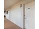 Hallway view of a unit door in a condominium featuring the unit number and hardware at 1 John Anderson Dr # 317, Ormond Beach, FL 32176