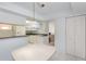 Bright kitchen featuring a charming pendant light and white cabinets for a classic appeal at 1 John Anderson Dr # 317, Ormond Beach, FL 32176