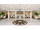 The lobby features an ornate tile floor design and a stairway with chandeliers overhead at 1 John Anderson Dr # 317, Ormond Beach, FL 32176