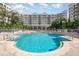 Take a dip in the sparkling blue pool surrounded by lush landscaping and a resort-style setting at 1 John Anderson Dr # 317, Ormond Beach, FL 32176