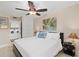 Comfortable bedroom with a cozy bed, convenient laundry area, and a relaxing ambiance at 100 S Interlachen Ave # 111, Winter Park, FL 32789