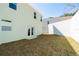 A compact backyard featuring a grassy area and a privacy fence at 1039 Morningside Dr, Eustis, FL 32726