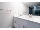 Elegant bathroom boasts dual sinks, bright countertops and modern fixtures at 1039 Morningside Dr, Eustis, FL 32726