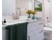 Bathroom with a white vanity, brushed nickel faucet, and elegant decor at 1039 Morningside Dr, Eustis, FL 32726