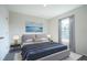 Staged bedroom featuring plush carpet flooring, modern furniture and an ocean themed artwork at 1039 Morningside Dr, Eustis, FL 32726