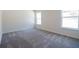 Neutral bedroom featuring plush carpet flooring, two bright windows allowing for great natural light at 1039 Morningside Dr, Eustis, FL 32726