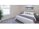 Staged bedroom featuring plush carpet flooring, modern furniture and a city themed artwork at 1039 Morningside Dr, Eustis, FL 32726