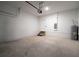 Clean garage with a modern garage door, water heater, and access door at 1039 Morningside Dr, Eustis, FL 32726