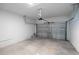 An empty garage with a standard-sized garage door at 1039 Morningside Dr, Eustis, FL 32726