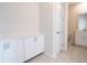 Convenient mud room with white cabinetry, quartz countertops and tiled floors at 1039 Morningside Dr, Eustis, FL 32726