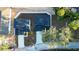 Aerial view of a home's roof, driveway, private backyard, and community, showcasing the property's layout at 1045 Morningside Dr, Eustis, FL 32726