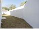 A view of the property's grass backyard and privacy fence, offering a private outdoor space at 1045 Morningside Dr, Eustis, FL 32726