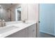 Bright bathroom features a double sink vanity, quartz countertop, and walk-in glass shower at 1045 Morningside Dr, Eustis, FL 32726
