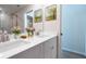 Bathroom boasting a double sink vanity, quartz countertop, decor and walk-in glass shower at 1045 Morningside Dr, Eustis, FL 32726