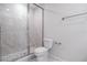 Elegant bathroom features a glass enclosed shower with marble tile and a modern toilet at 1045 Morningside Dr, Eustis, FL 32726