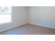 Bright bedroom with natural light highlighting the beautiful hardwood floors at 1045 Morningside Dr, Eustis, FL 32726