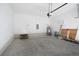 Spacious garage featuring white-painted block walls, concrete floor, and garage door with automatic opener at 1045 Morningside Dr, Eustis, FL 32726