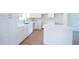 Bright kitchen featuring white cabinets, countertops, and modern finishes, creating a clean and stylish space at 1045 Morningside Dr, Eustis, FL 32726