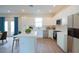 Open-concept kitchen with modern appliances, countertops, and ample cabinet space, perfect for Gathering gatherings at 1045 Morningside Dr, Eustis, FL 32726