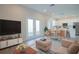 Bright and airy living room featuring modern decor and an open floor plan to the kitchen at 1045 Morningside Dr, Eustis, FL 32726