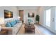 Welcoming living room with neutral tones and a large window bringing the outside in at 1045 Morningside Dr, Eustis, FL 32726
