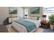Stylishly decorated main bedroom with a comfy bed, artwork, and coordinating furniture at 1045 Morningside Dr, Eustis, FL 32726