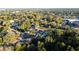 An aerial view showing a well-established neighborhood with many trees and homes close to town at 1045 Morningside Dr, Eustis, FL 32726