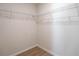 Bright walk-in closet features a wire shelving system and wood-look floors at 1045 Morningside Dr, Eustis, FL 32726