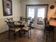 Bright breakfast nook features a glass table, four chairs, and French doors leading to the lanai at 10839 Sw 78Th Ct, Ocala, FL 34476