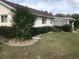 The home features a well-maintained lawn, mature landscaping, and a screened porch at 10839 Sw 78Th Ct, Ocala, FL 34476