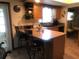 Eat-in kitchen features a breakfast bar, pendant lighting, and a functional layout at 10839 Sw 78Th Ct, Ocala, FL 34476