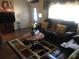 Inviting living room with a comfortable sofa, decorative rug, and natural light at 10839 Sw 78Th Ct, Ocala, FL 34476