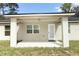 Back porch features neutral colors and natural lighting looking out onto the backyard at 1090 Parnell Ct, Deltona, FL 32738