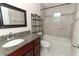 Bathroom features granite counters and tub with tiled walls and shower at 1090 Parnell Ct, Deltona, FL 32738