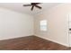 This spacious bedroom features hardwood floors, neutral paint, and natural light at 1090 Parnell Ct, Deltona, FL 32738