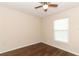 Bedroom featuring wood-look flooring, ceiling fan, and a window at 1090 Parnell Ct, Deltona, FL 32738