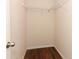 Walk-in closet with wood floors, a hanging rod, and wire shelving at 1090 Parnell Ct, Deltona, FL 32738