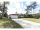 Exterior of the home with a long driveway and well-maintained lawn at 1090 Parnell Ct, Deltona, FL 32738