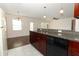 Bright, open kitchen with granite countertops, stainless appliances and breakfast bar at 1090 Parnell Ct, Deltona, FL 32738