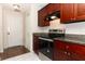 Well-equipped kitchen with modern appliances, granite countertops, and ample cabinet space at 1090 Parnell Ct, Deltona, FL 32738