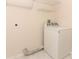 Laundry room with tiled flooring, shelving and a white washer at 1090 Parnell Ct, Deltona, FL 32738