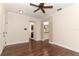 Bright and airy living room features hardwood floors and views into the kitchen at 1090 Parnell Ct, Deltona, FL 32738